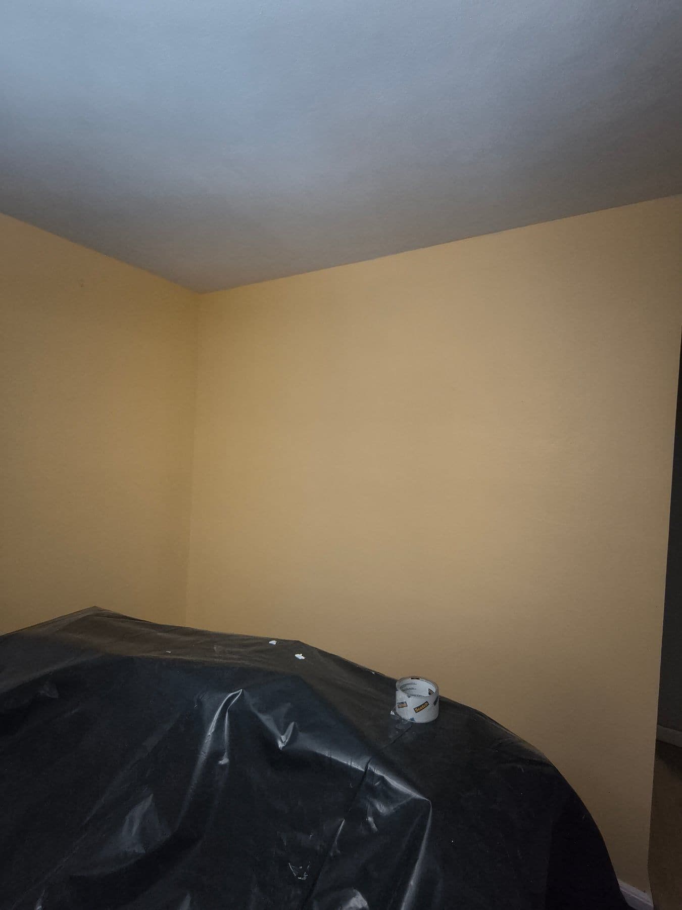 Bedroom walls painted in a warm cream tone