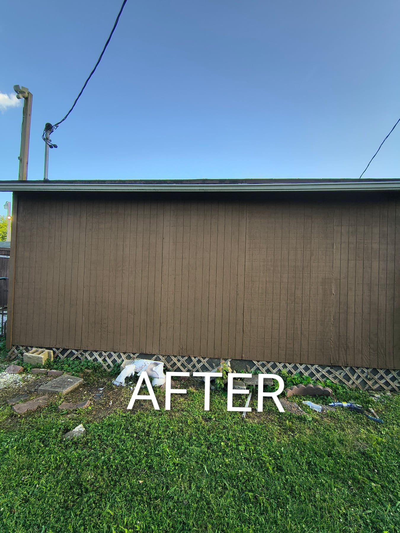 Shed siding after a fresh coat of brown exterior paint